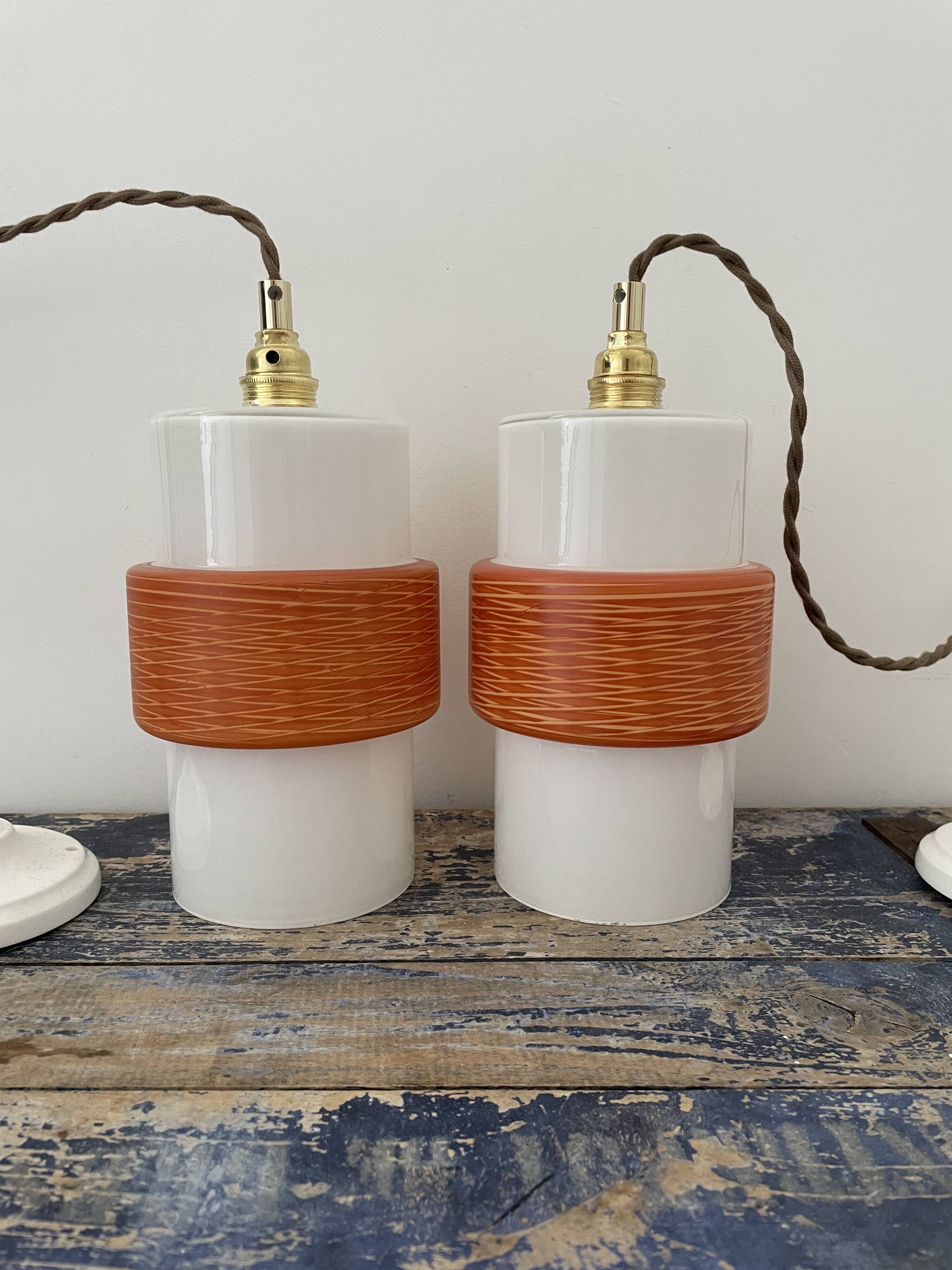 Pair of vintage suspensions electrified to nine