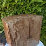 Small freestanding or wall-mounted wooden cabinet.