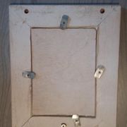 Wooden frame with 4 metal corners