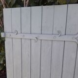 Pair of wooden shutters hanging iron