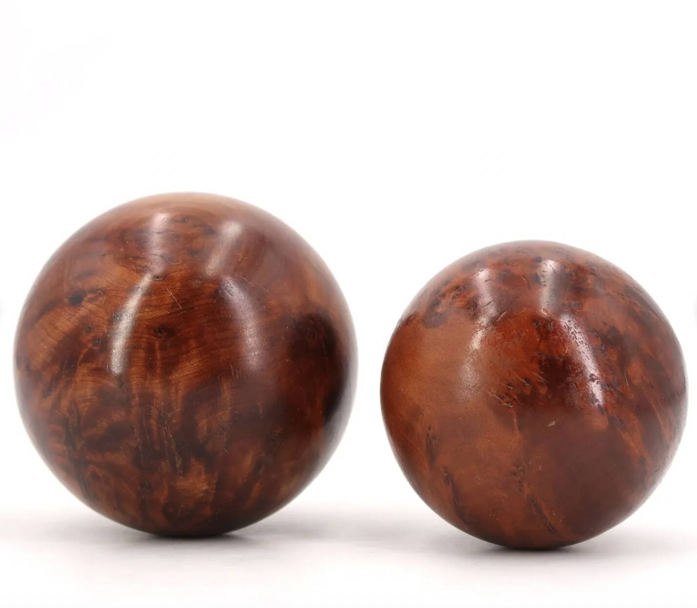 Sculptures of spheres carved in elm burl wood