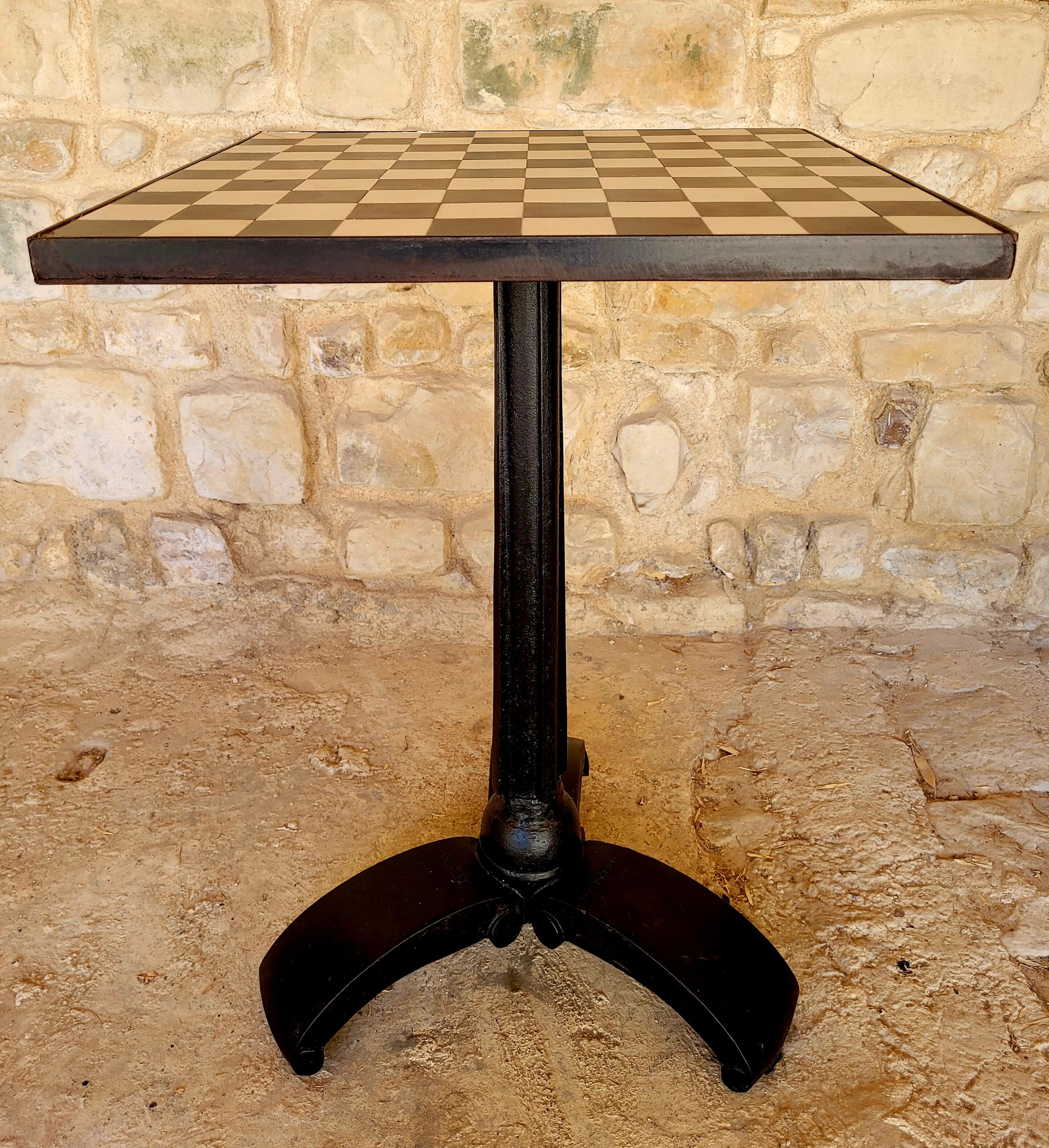 Old vintage bistro table brand Fischel in cast iron