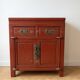 Chinese storage furniture in red lacquered wood