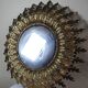 Large Italian sunburst wall mirror in gilded metal, 1960s-70s.