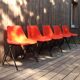 5 orange plastic chairs by Robin Day for Hille