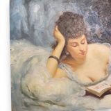 Young woman lying reading oil on panel