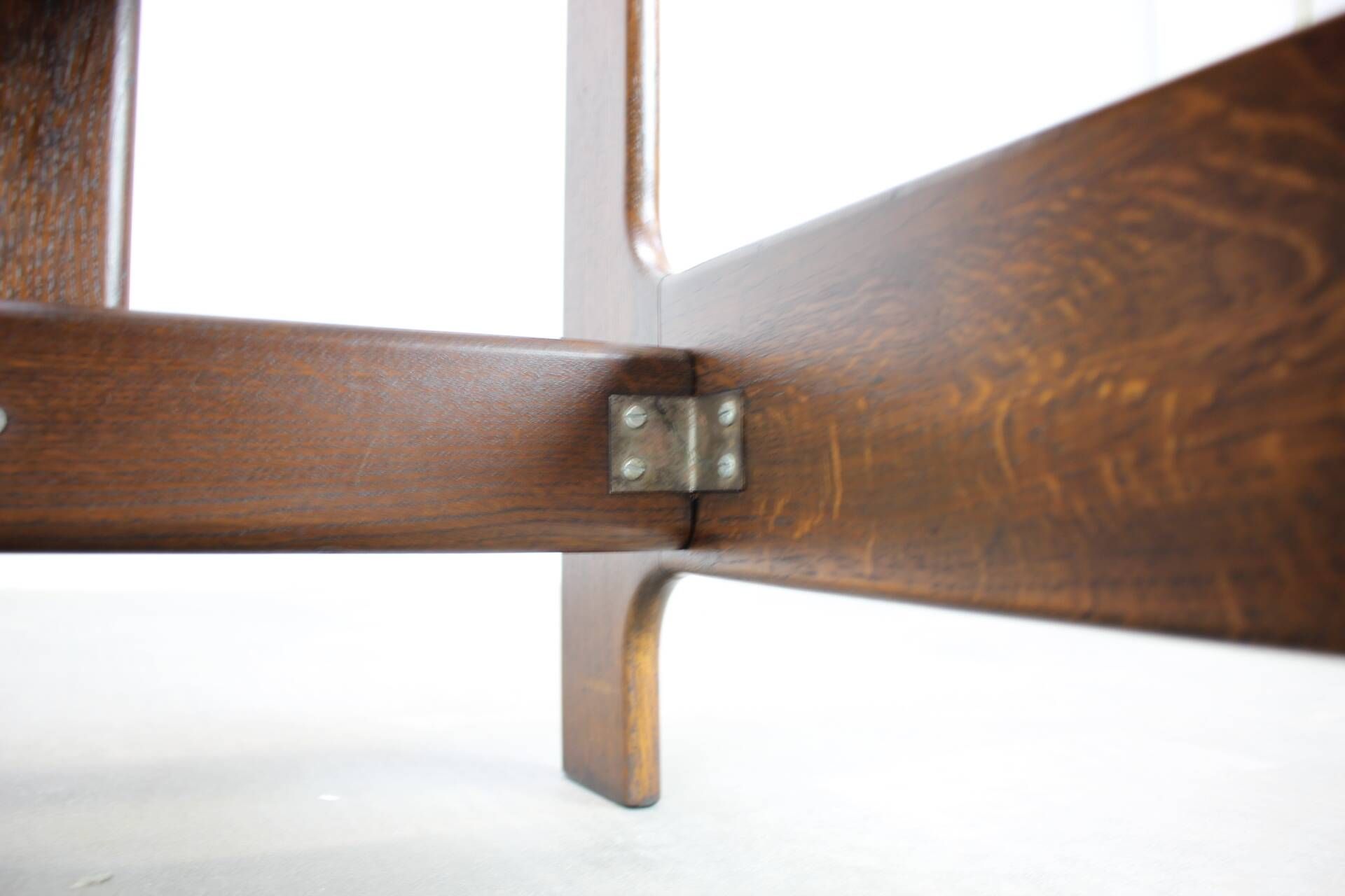 Vintage German sculptural chair from the 1970s in wood with orange faux leather.