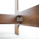 Vintage German sculptural chair from the 1970s in wood with orange faux leather.
