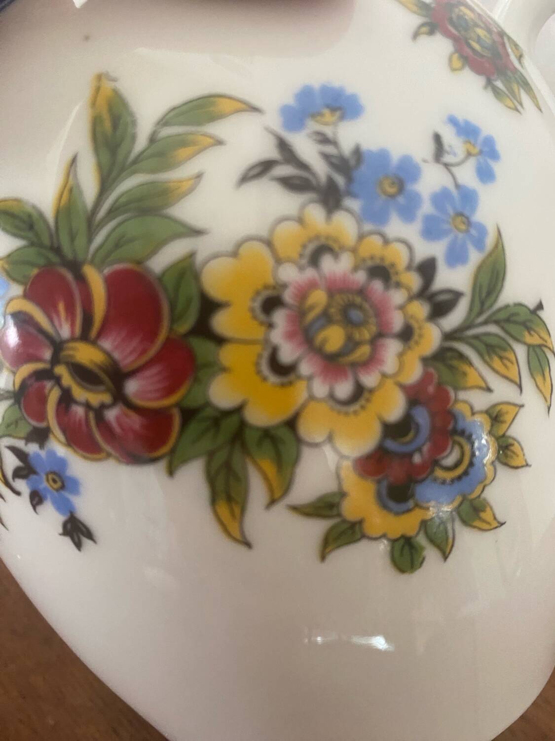 Large sugar bowl with floral porcelain.