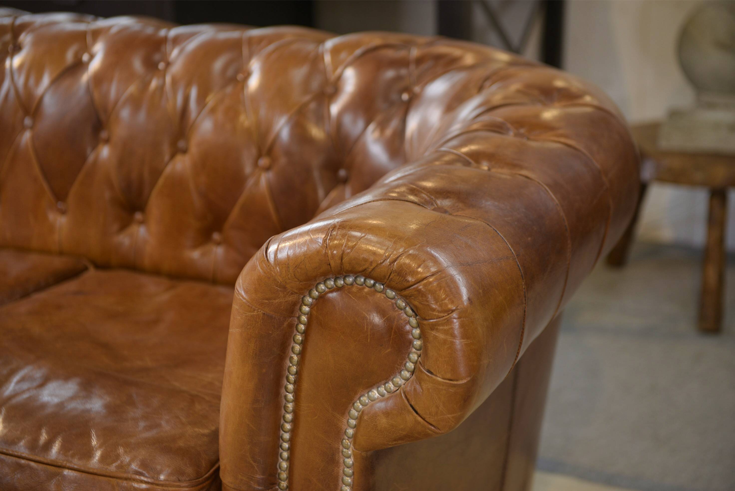 Brown leather Chesterfield sofa