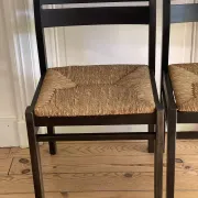 Pair of straw-seated wooden chairs in the regain style.