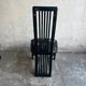 Set of 6 black lacquered wooden dining chairs with high backs and patterned fabric seats, 1980s.