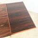 Rosewood dining table with integrated extensions — Denmark, 1960s