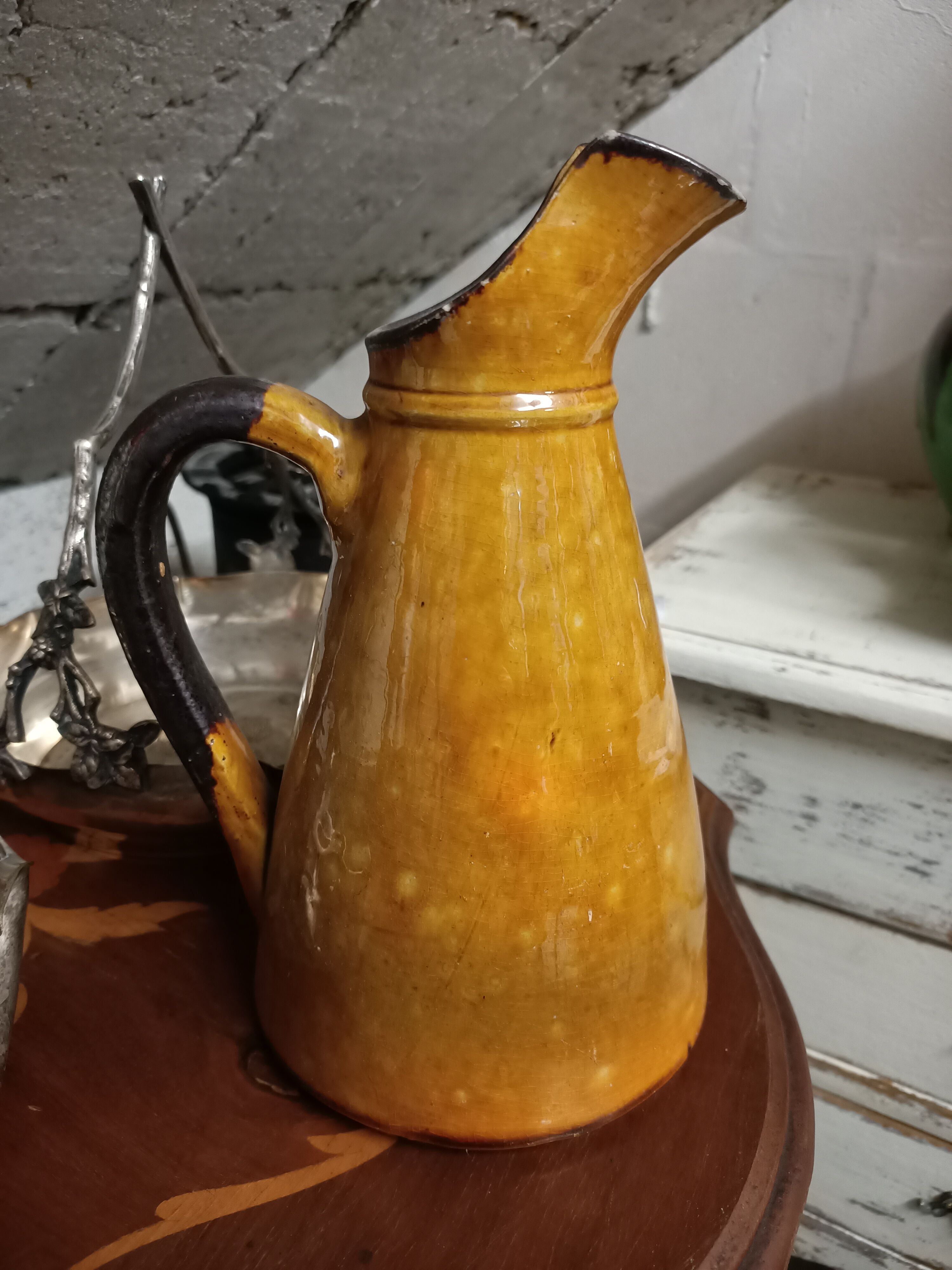 Enamelled terracotta jug