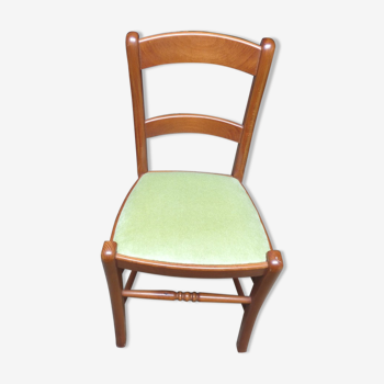 Chic cherry wood chair trimmed in green velvet