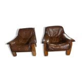 Armchairs in leather and vintage wood 70's