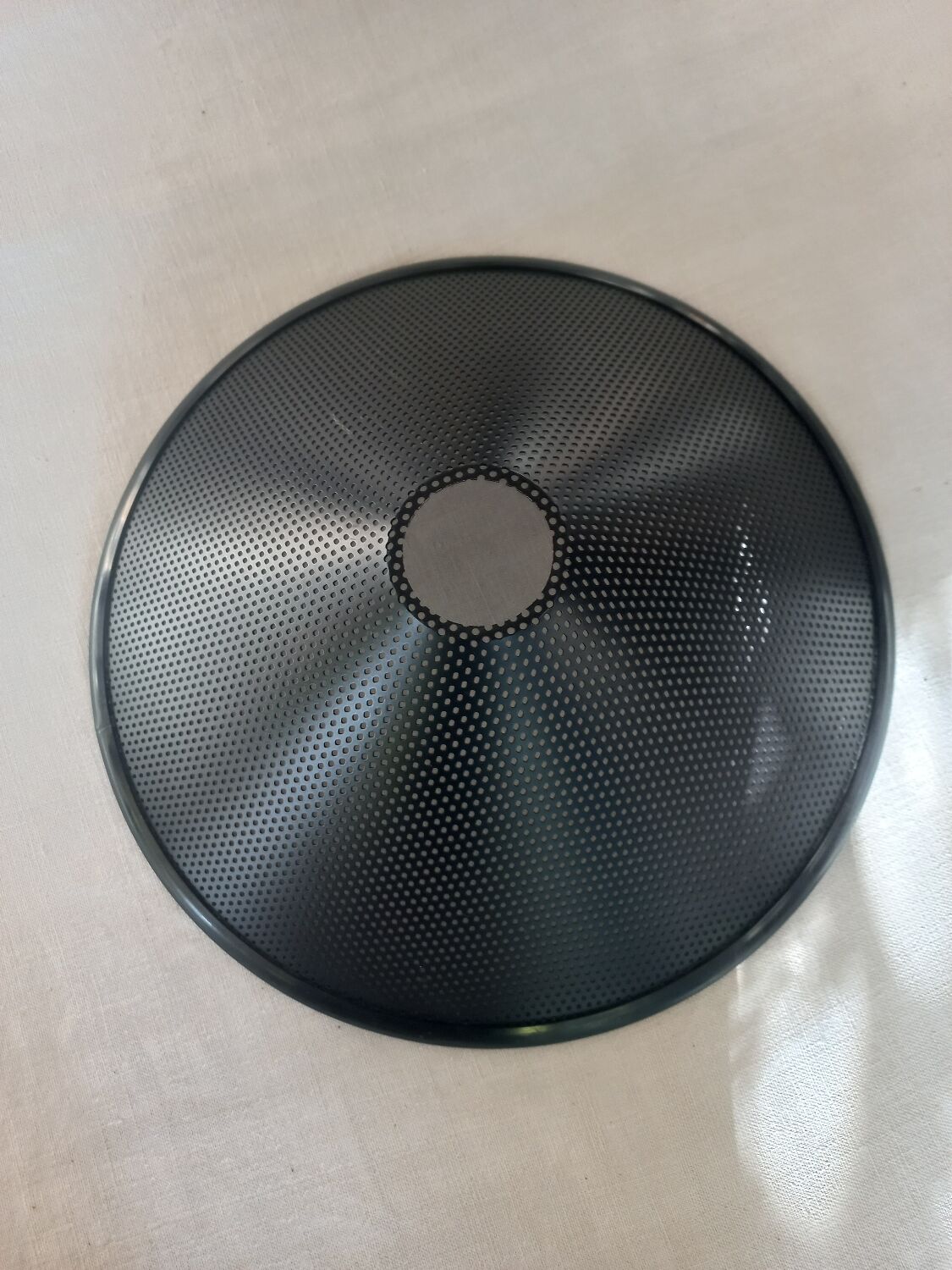 Black perforated metal day abatement