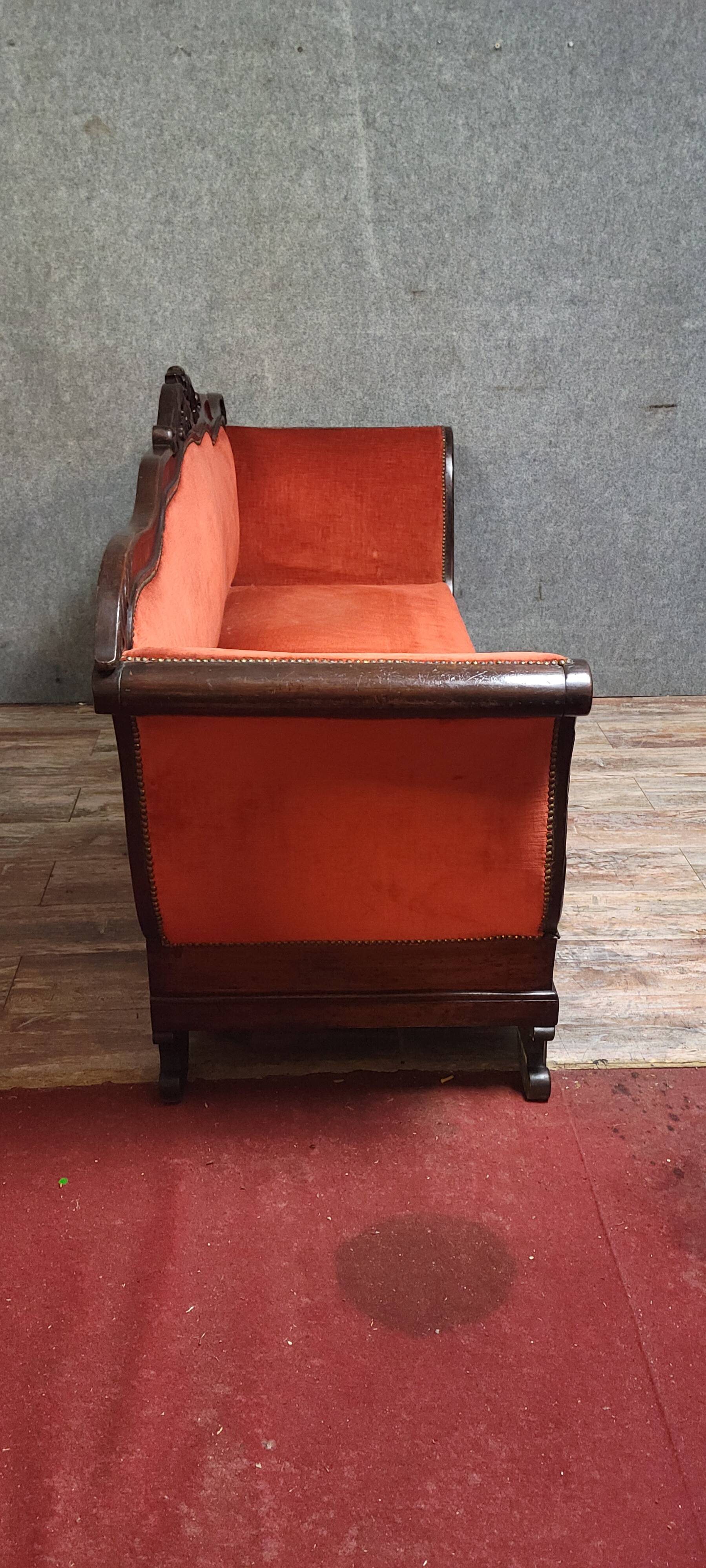Sleeper or bench from the Charles X period in richly carved mahogany.