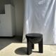 Black mango wood tripod side table with a semi-spherical top, height: 45 cm, diameter: 44 cm.