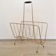 Vintage magazine rack in gold metal
