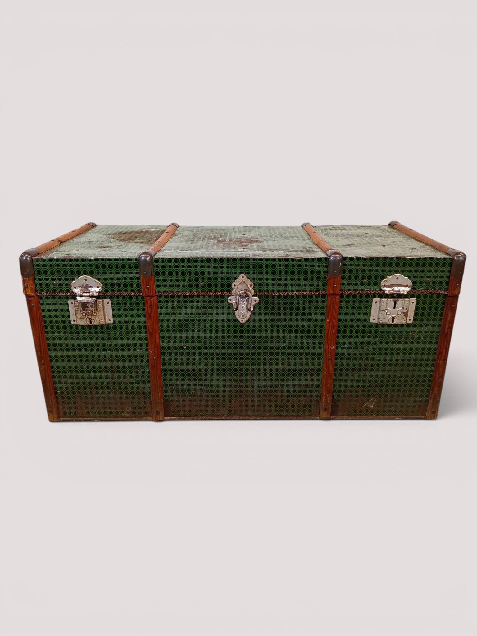 Vintage wooden and metal green travel trunk, circa 1930.