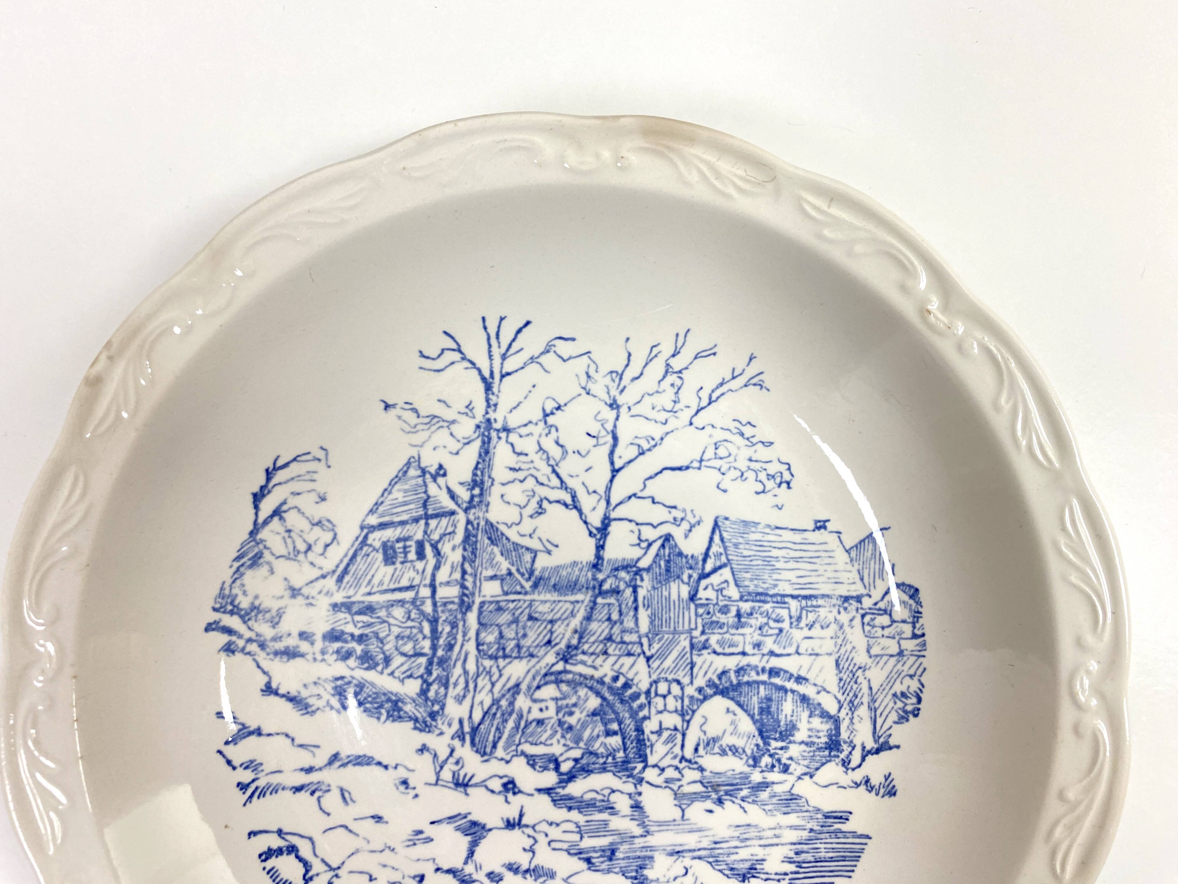 Set of two matching soup plates, one plain and one decorated