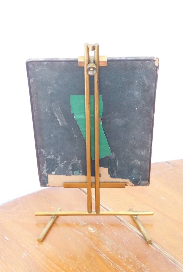 Table mirror on a brass easel