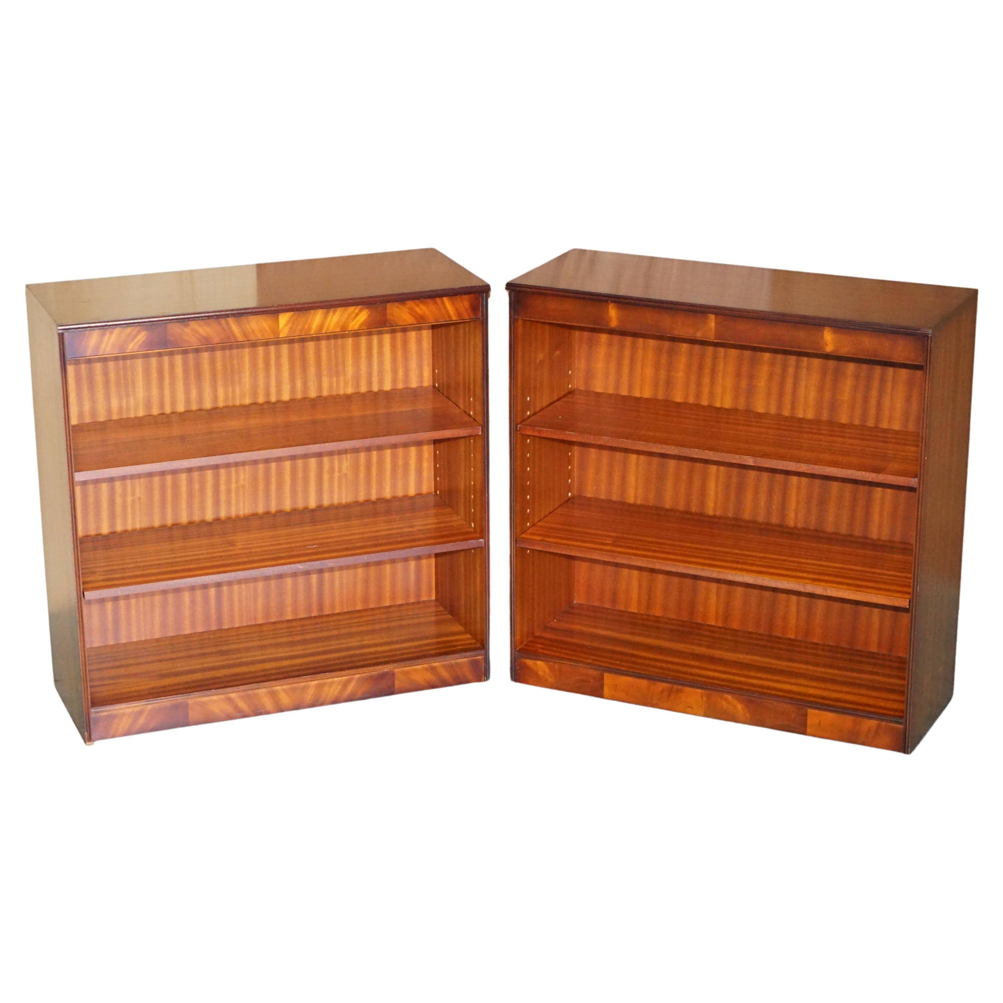Pair of open low bookshelves Shaws of London in hardwood.