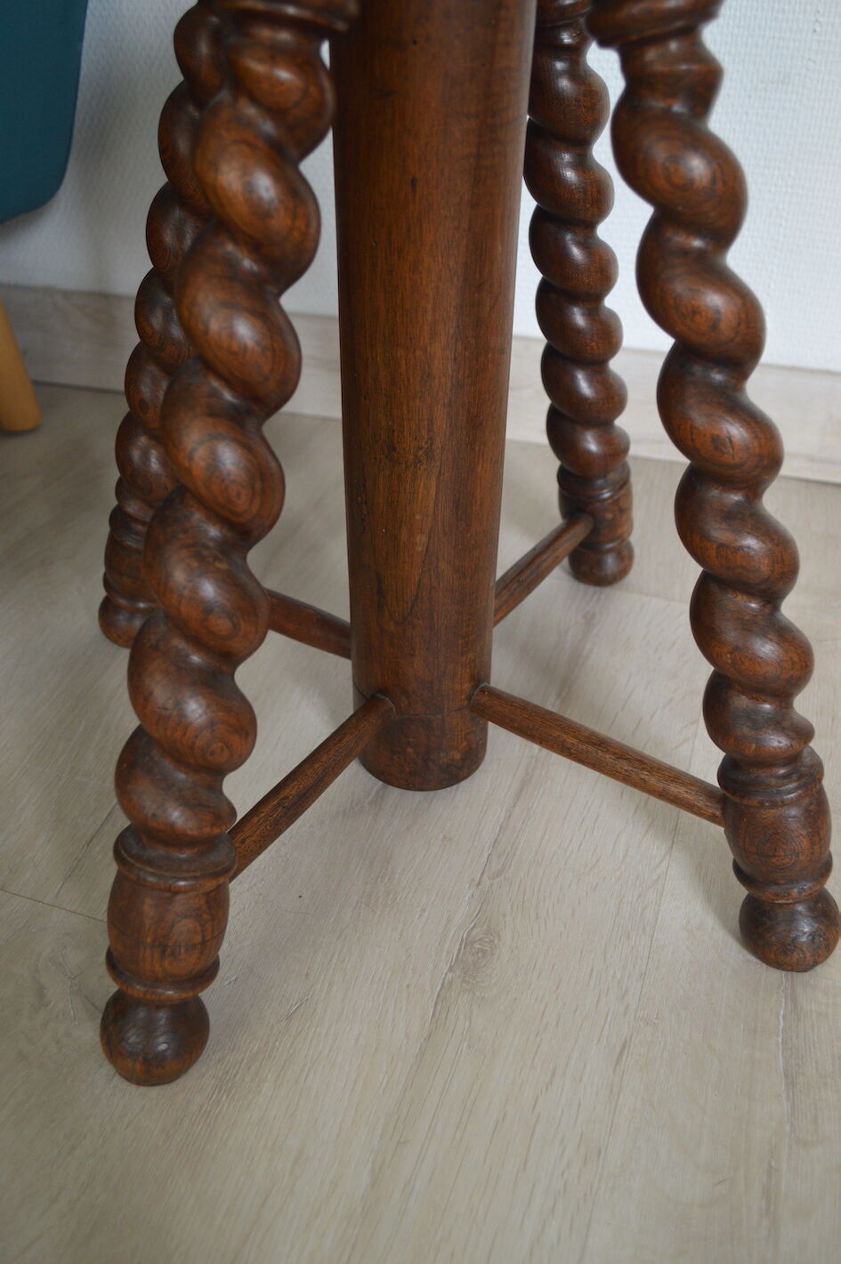 Antique piano stool with adjustable screws and turned wooden legs