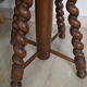 Antique piano stool with adjustable screws and turned wooden legs