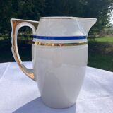 White porcelain decanter with blue and gold edging