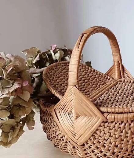 Handcrafted egg basket made of woven rattan and wicker