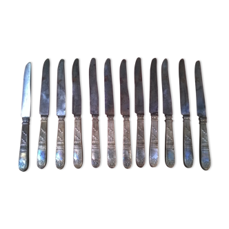 Twelve old silver metal knives, complete