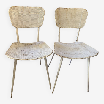 Pair of white metal chairs