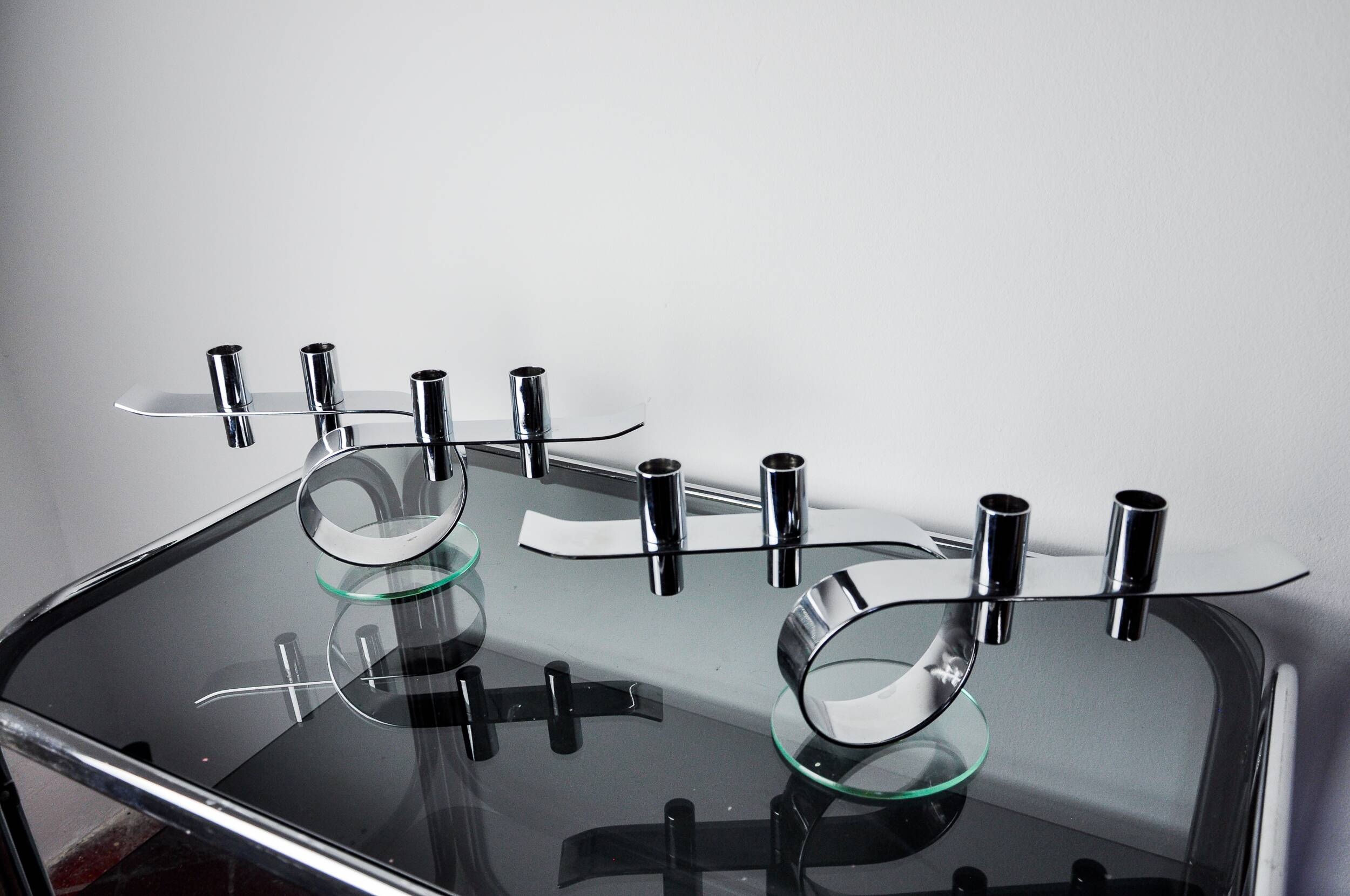 Pair of space-age 4-flame candlesticks, glass and metal, Germany, 1980