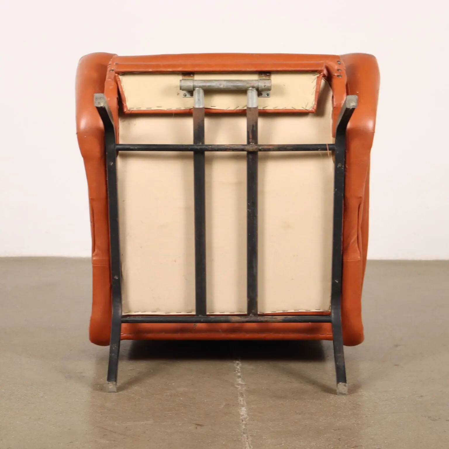 Vintage armchair from the 1970s in foam, faux leather, and metal.