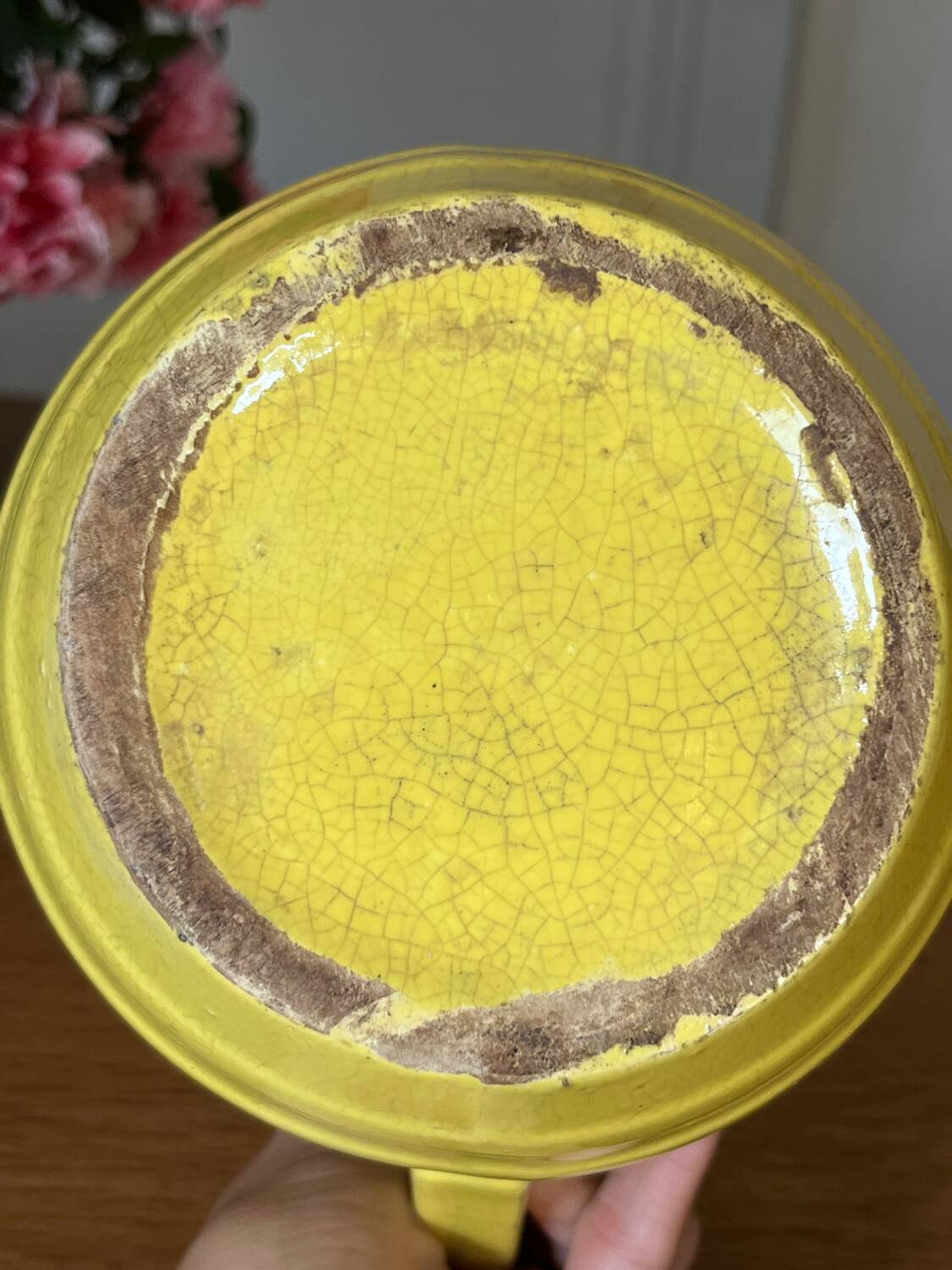 Old yellow ceramic pitcher