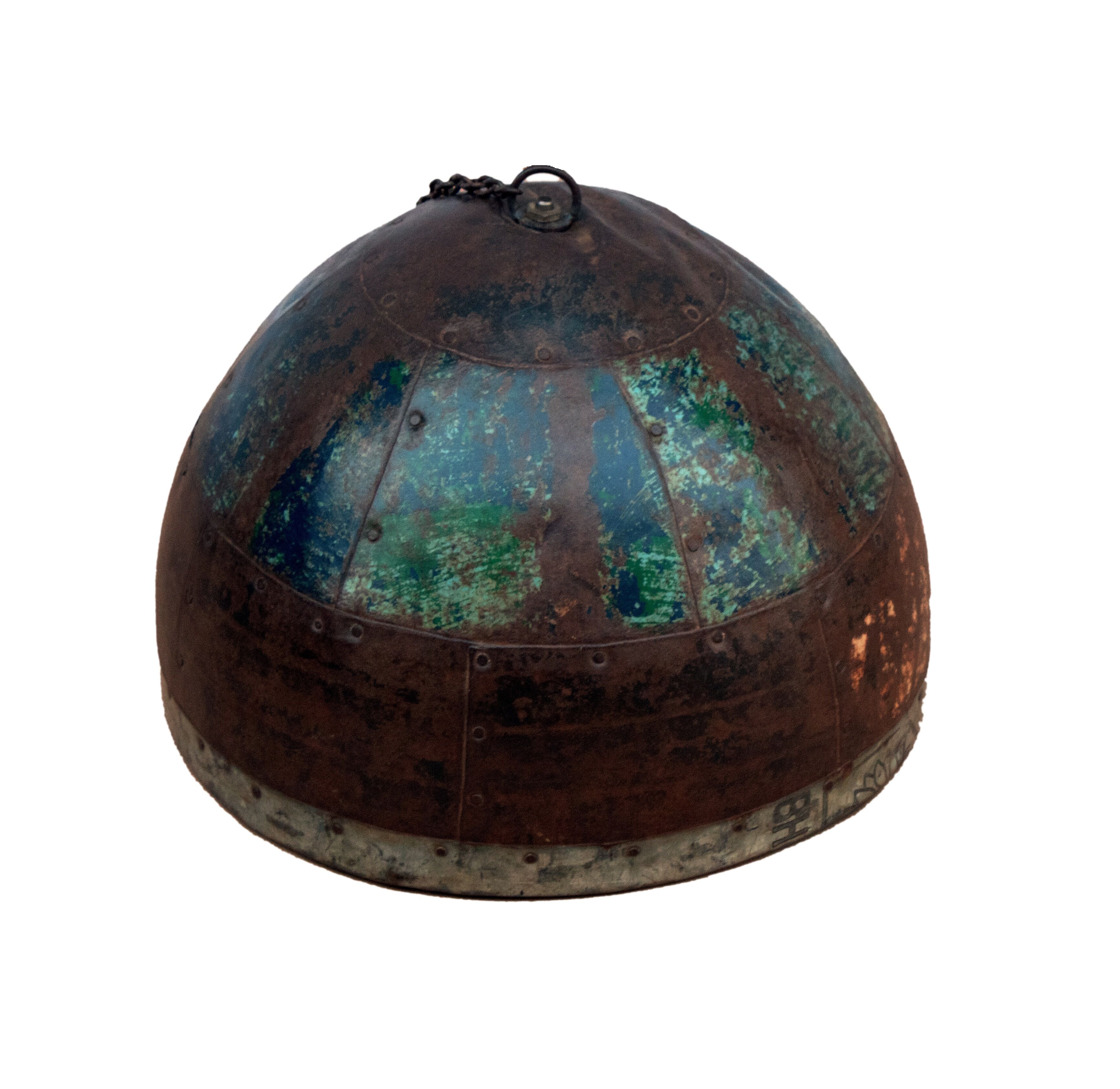 Metal hanging with its original blue-green-rust colour