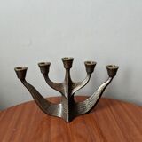 Vintage bronze candlestick chandelier in contemporary Scandinavian design.