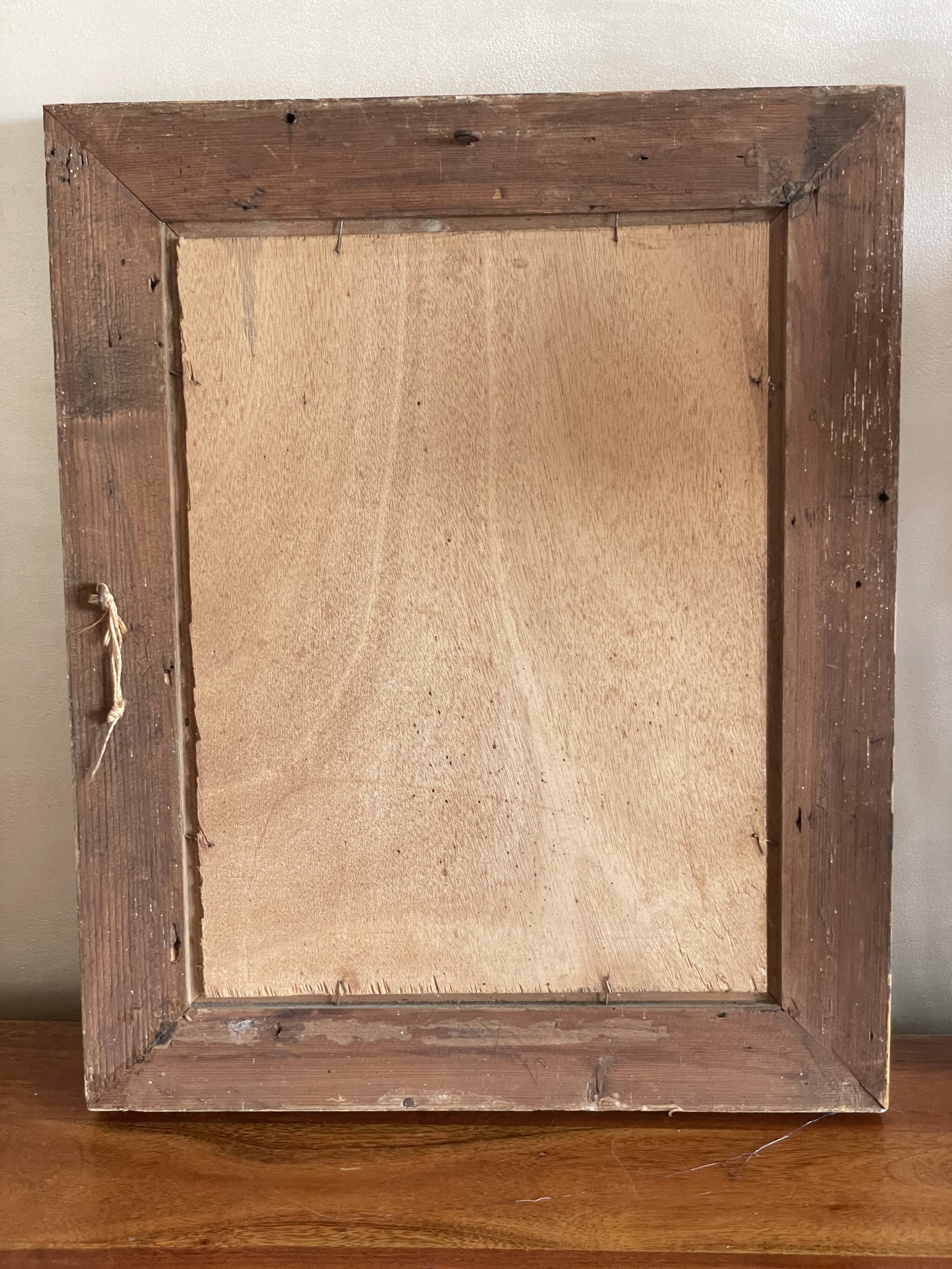 Portrait of young woman painting on wood