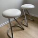 Pair of vintage Z low stools with chrome metal base and white skai seat. H: 49 cm 80s