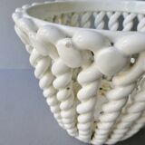 Openwork and braided ceramic pot cover