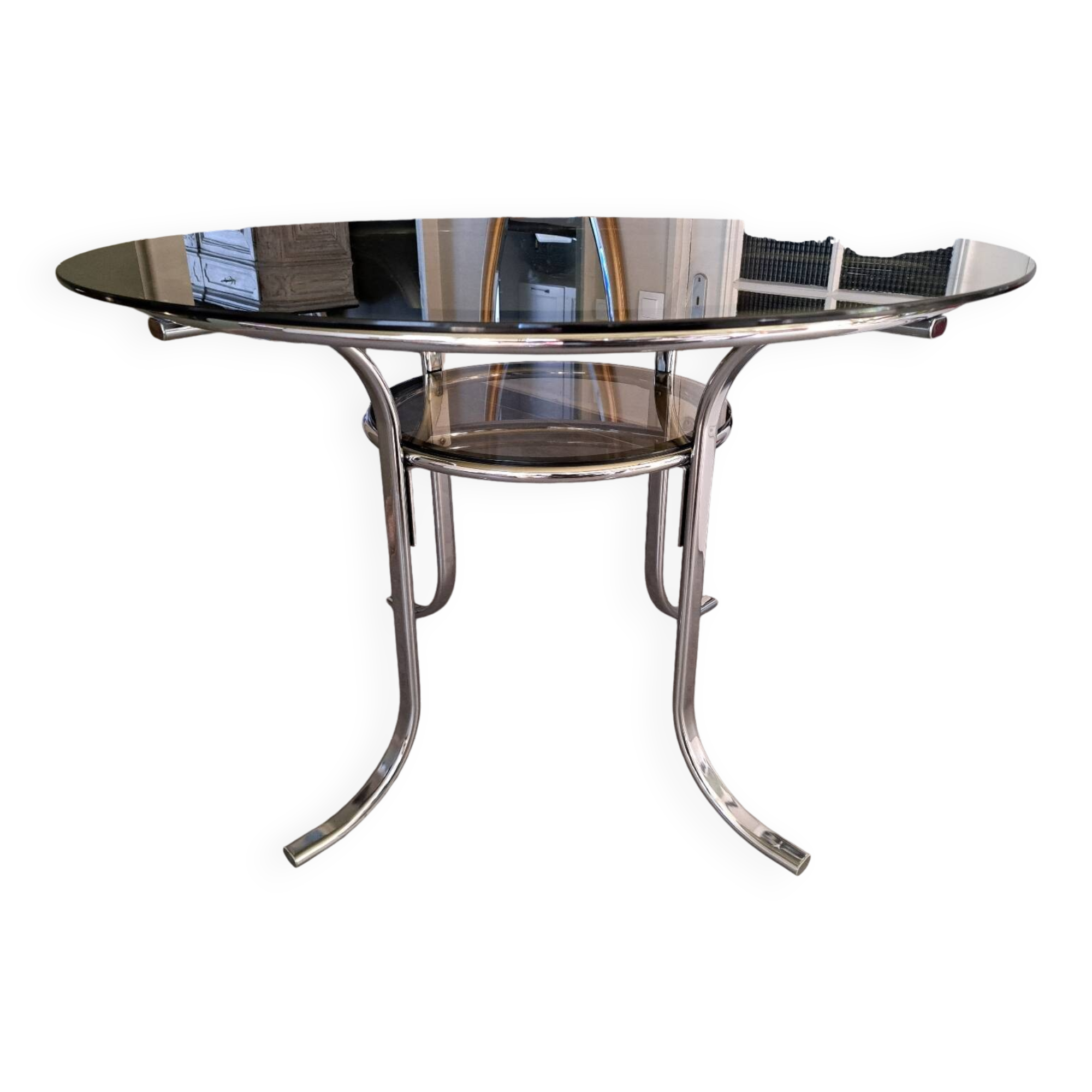 Round table in chromed metal and smoked glass