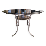 Round table in chromed metal and smoked glass