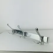 Wall-mounted coat rack, strip of 3 aluminium hooks from the 1960s.