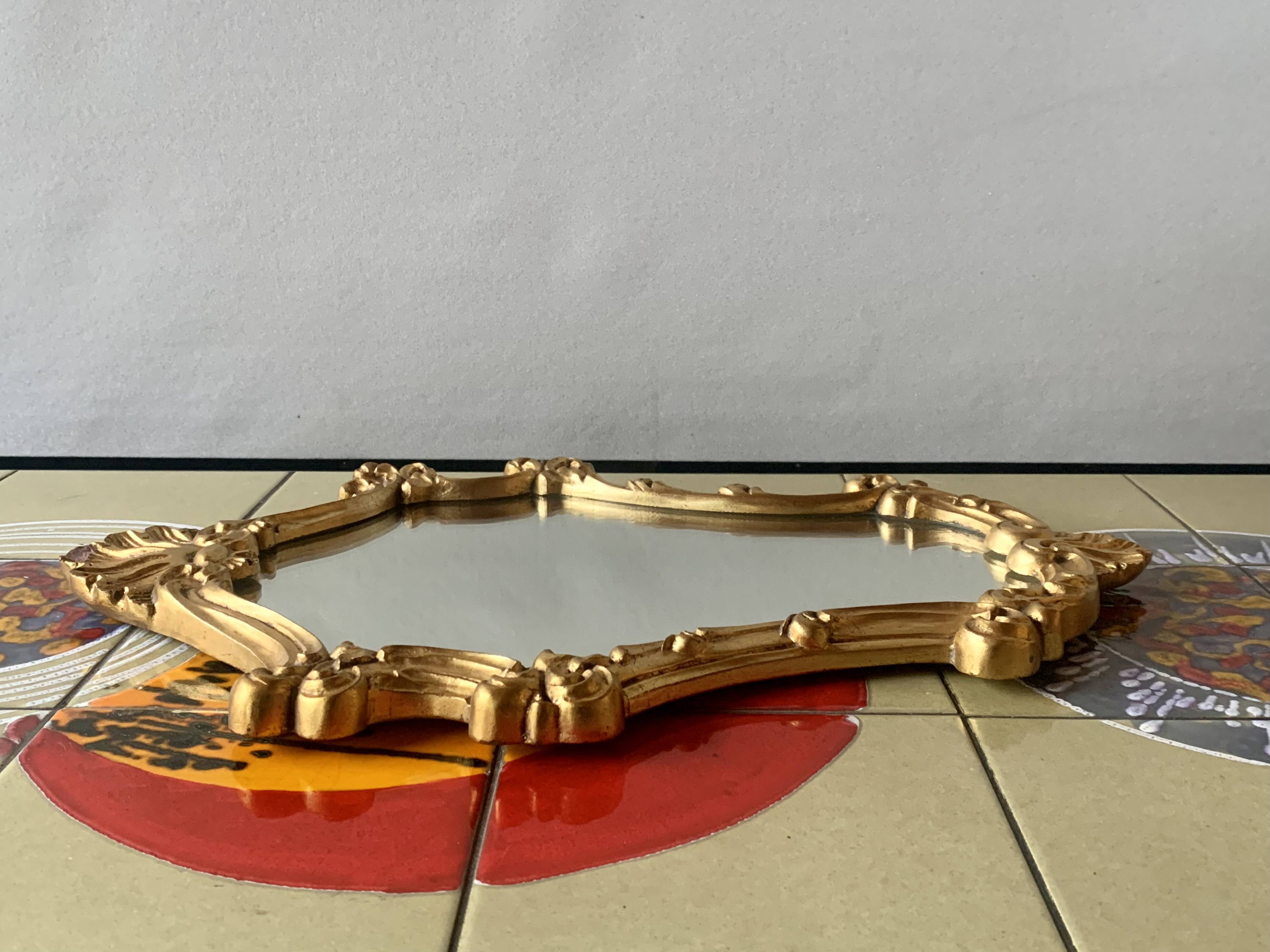 Vintage wall mirror in gold plaster - rococo style