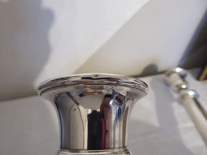 Pair of silver metal candle holders