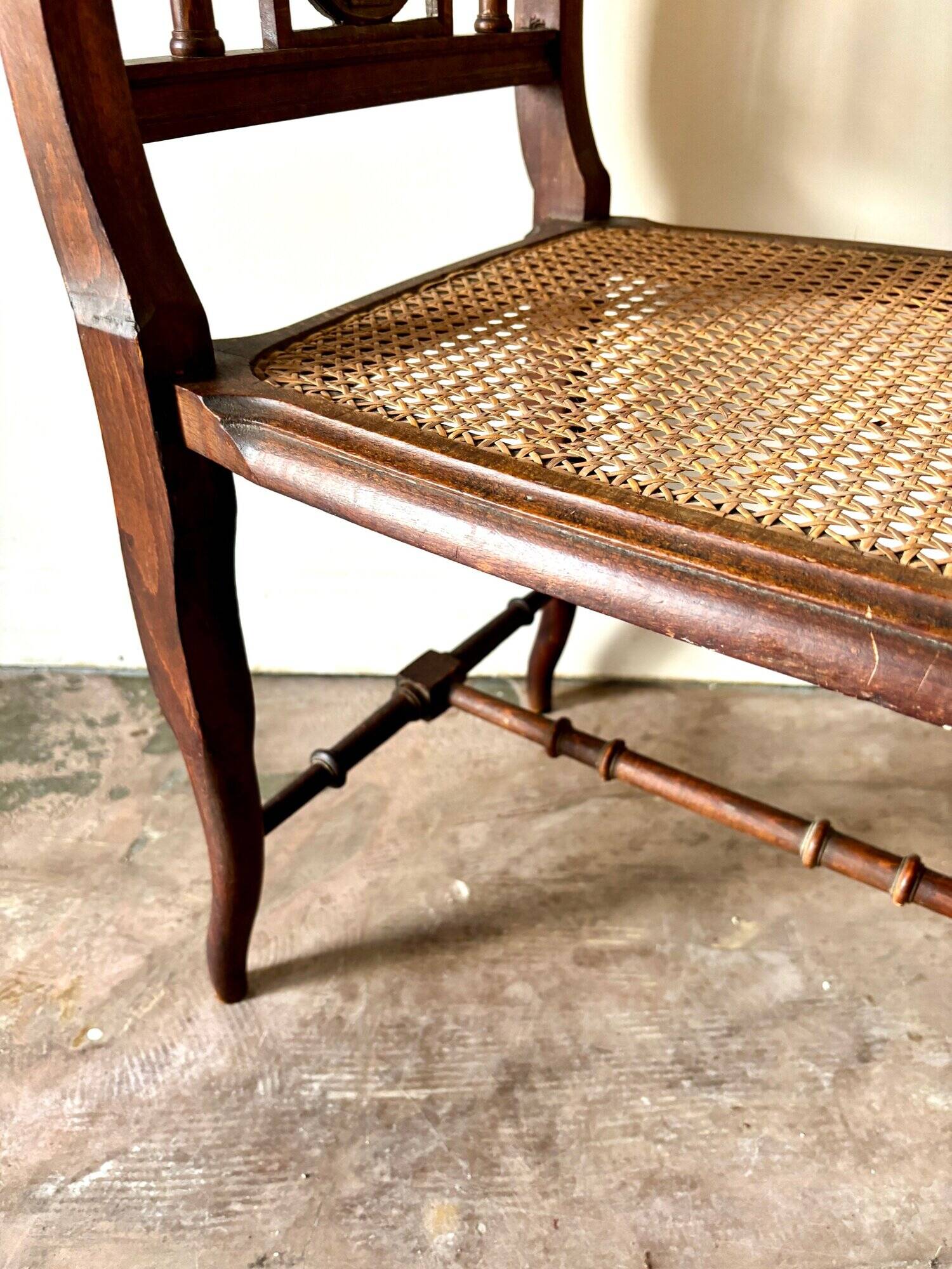 Dark wood and cane bench