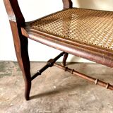 Dark wood and cane bench