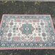 Vintage oriental rug in burgundy red, 133x196cm.